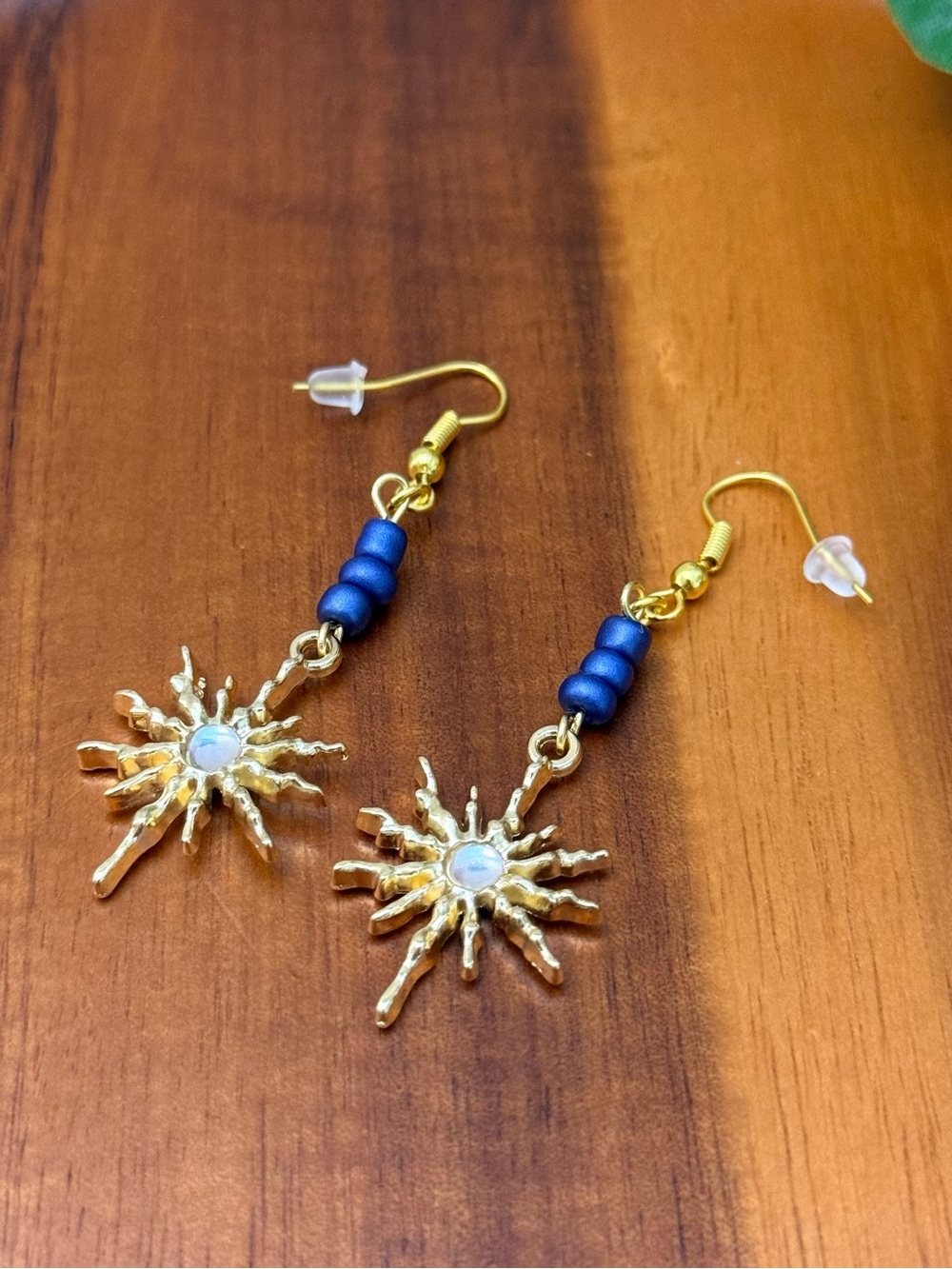 Gold Sunburst Drop Earrings with Blue Beads